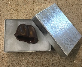 The chocolate ears tucked into a silver foil gift box for later
